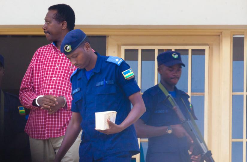 Kabuye is escorted out of the court on Monday. (Timothy Kisambira)