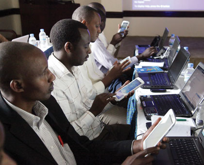 Teachers use tablets to surf the Internet at a recent workshop. Internet penetration is still low in Rwanda.  John Mbanda  
