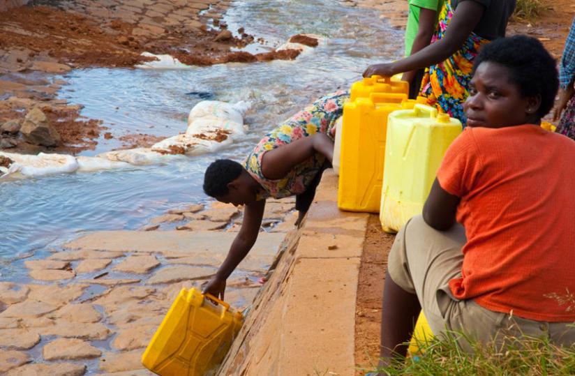 People draw water in Kimisagara, a Kigali City suburb. Recent research shows that about  480 million people in Africa will face water scarcity by 2025. (File)