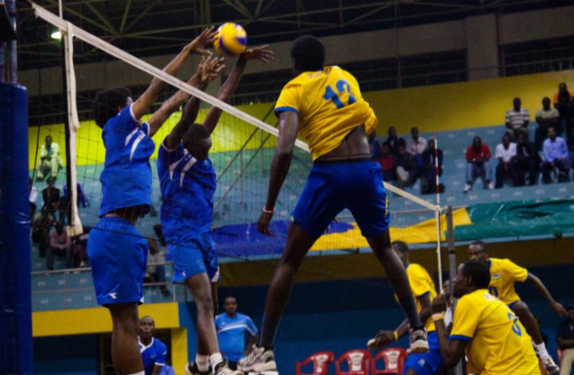 Mukunzi (#12) goes up for a spike during a training match between the national team and league side Rayon Sports early this year. (Timothy Kisambira)