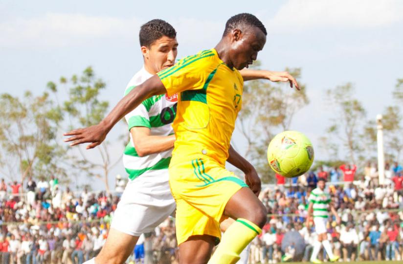AS Kigali striker Amin Mwizerwa, taking on El Djadida defender during the first leg of this year's Caf Confederation Cup. (Timothy Kisambira)