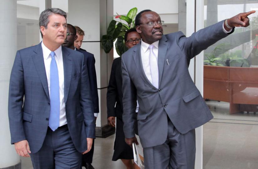 Trade and Industry minister Francois Kanimba (R) shows visiting World Trade Organisation director-general Roberto Azevu00c3u00aado  around after their meeting in Kigali yesterday. (John Mbanda)