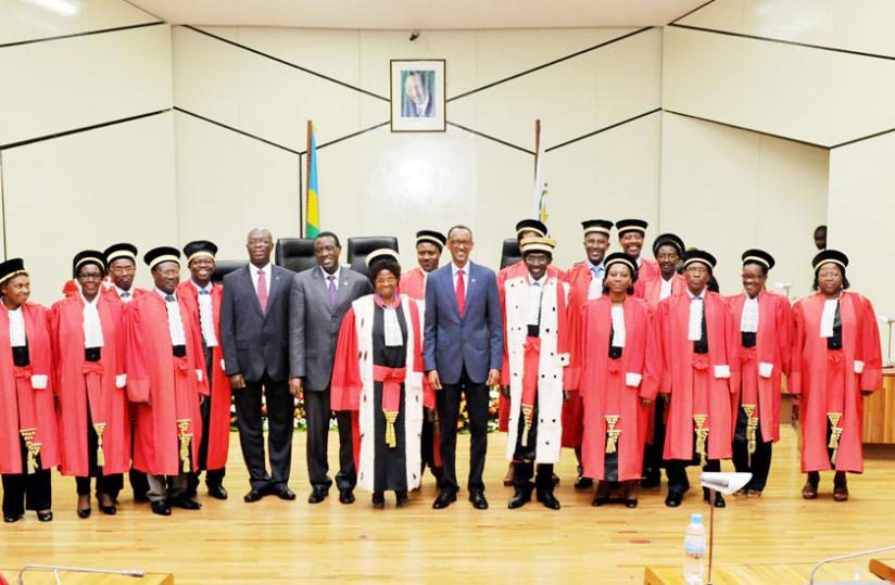President Kagame poses with members of the Judiciary (in robes) and and other officials, including Senate President Jean-Damascu00c3u00a8ne Ntawukuriryayo (second-left from the President) and PM Anastase Murekezi, during the launch of the Judicial Year 2014/2015 at Parliament yesterday.  rn(Village Urugwiro)