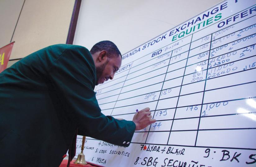A trader records deals at the local bourse. The Rwanda Stock Exchange presents huge opportunities to small-and-medium businesses. (File Photo)