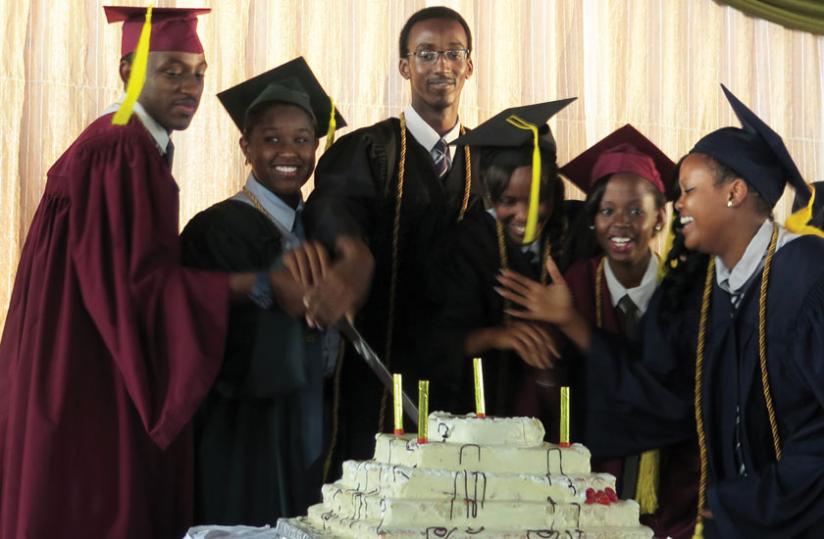 Students cut a cake at their graduation ceremony recently. Any person can do anything they put their mind to. (Courtesy)