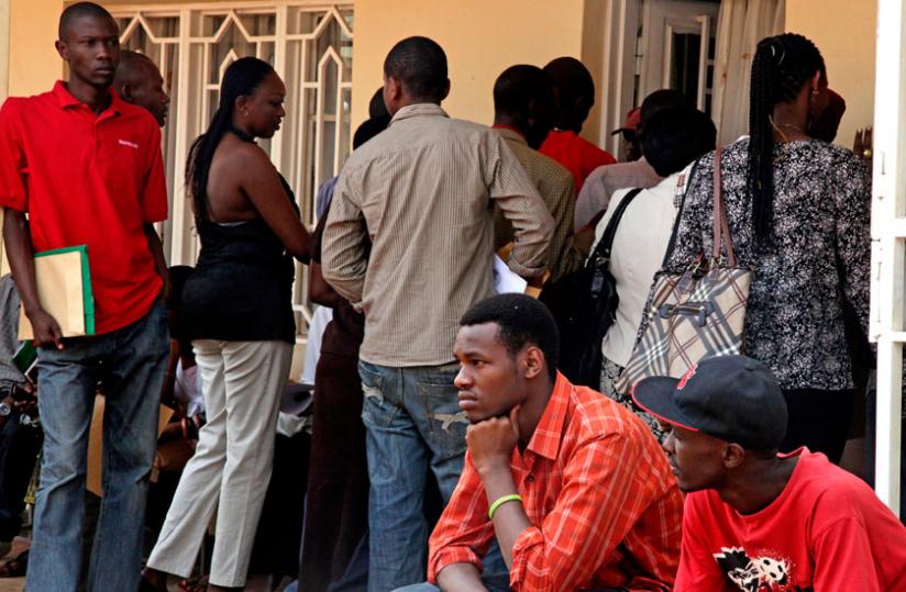 Citizens await to be cleared by Kicukiro Notary office. The online platform is envisaged to end the burden of queuing. (File)