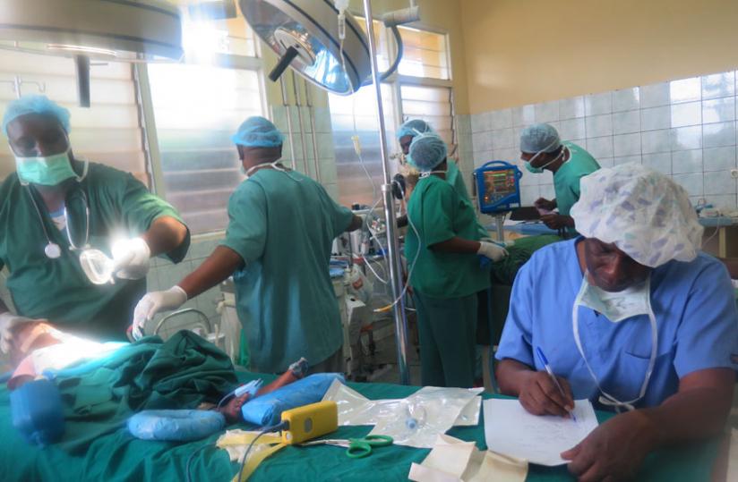Medics carry out a cleft lip surgery at Rwamagana hospital yesterday. (Stephen Rwembeho)