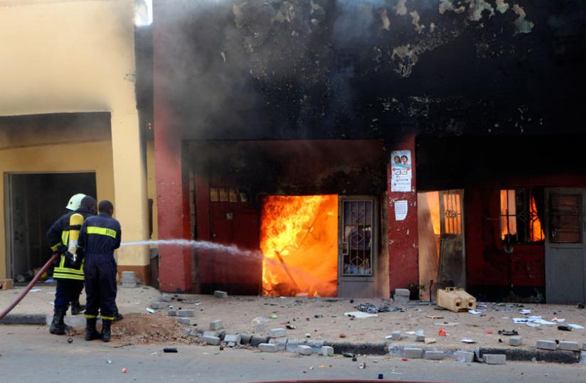 Firefighters struggle to contain a blaze in Kigaliu00e2u20acu2122s Quartiern Mateus trading centre in July. (File)