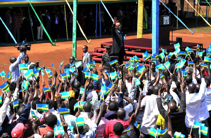 President Kagame waves to residents of Gikomera Sector during his citizen outreach tour of the area yesterday.  (Village Urugwiro)