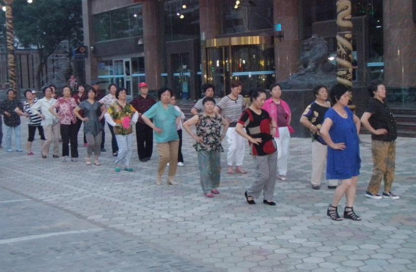Senior citizens perform the disco dance to stay fit on a street in Ningxia. (Paul Ntambara)