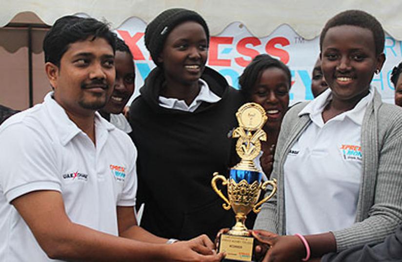 Queens of Victory Cricket Club players receive the trophy after beating Charity CC in the UAE Exchange & Xpress Money T20 final last year. (File photo)