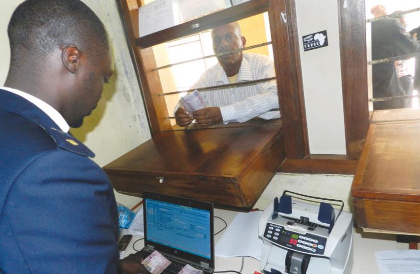 A customs officer serves a customer at Rusumo border. RRA is recruiting new workers including customs officers. (File)
