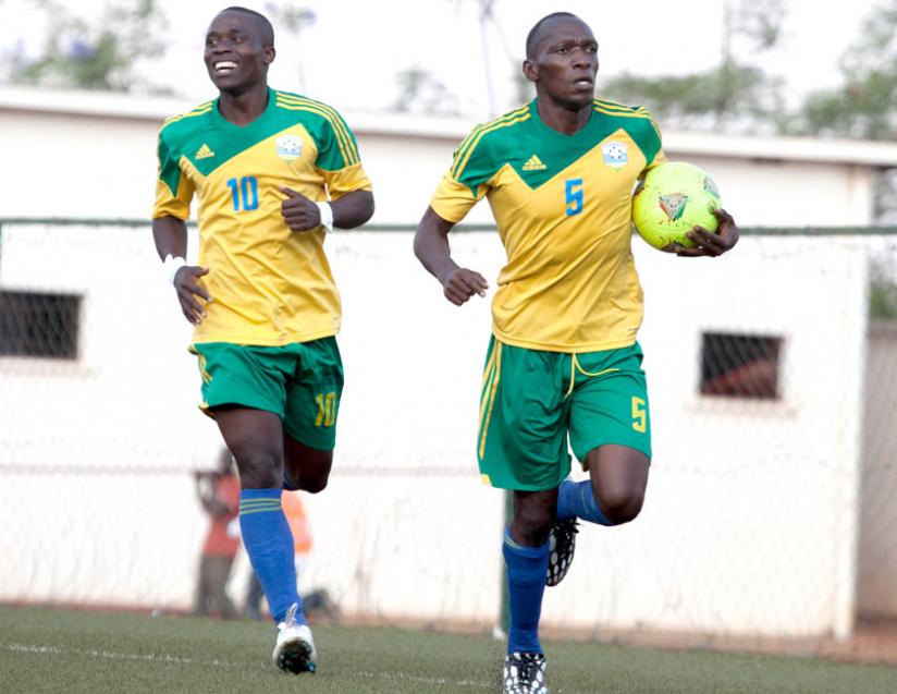 Amavubi strikers Meddy Kagere, right and Michel Ndahinduka celebrate the equalising goal against Congo. (T. Kisambira)rn