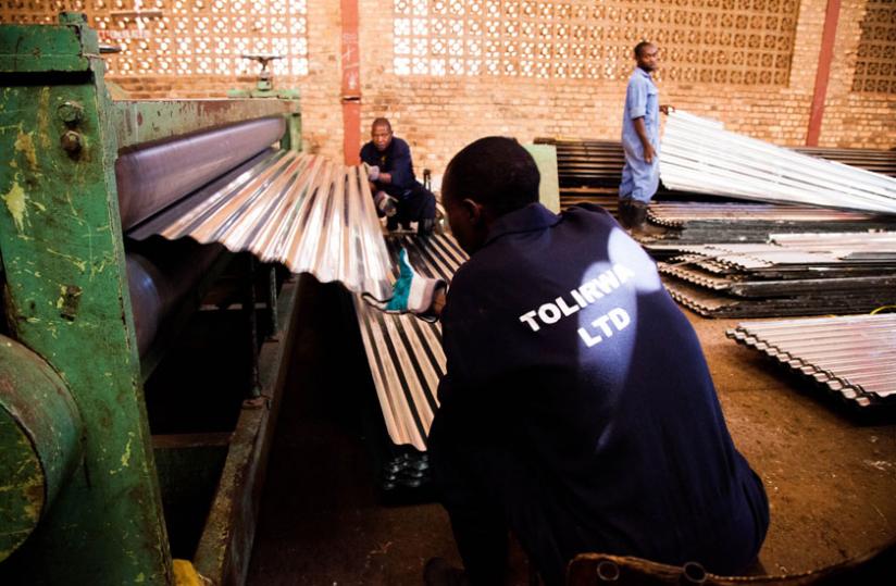 Workers at  Tolirwa factory in Kigali. (Timothy Kisambira)