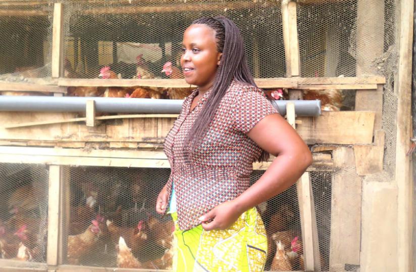 Petronia Mukadusabe at her  farm in Rwamagana district . She says her decision to ditch teaching for poultry is paying off (S. Rwembeho).