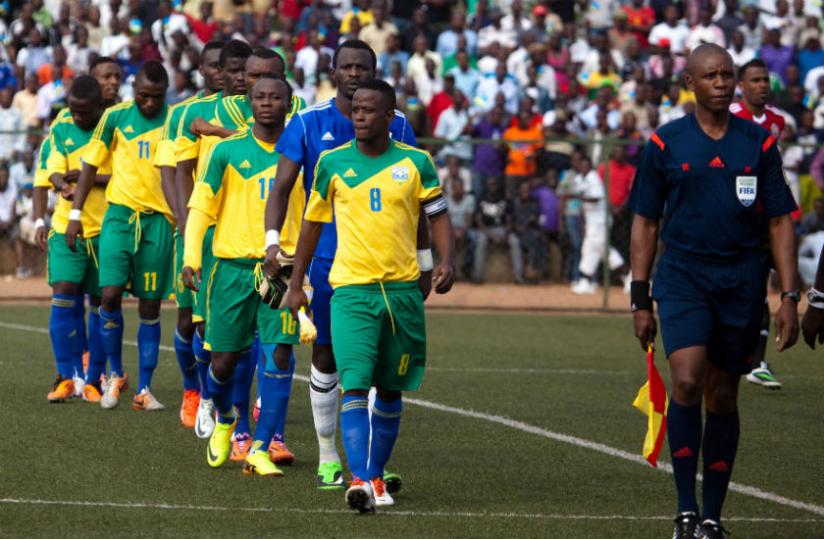 Amavubi's captain Haruna Niyonzima leads his teammates to the field for the 2015 Afcon Qualifier against Congo last month. (Timothy Kisambira)