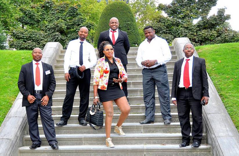 Du00c3u00a9siru00c3u00a9 Mbonabucya (2nd R) and his bride pose with the entourage at their wedding last weekend. Courtesy.
