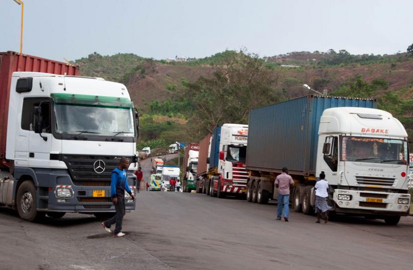 Trucks carrying exports cross via the border at Rusumo. A cluase on export taxes has stalled a trade deal. (File)