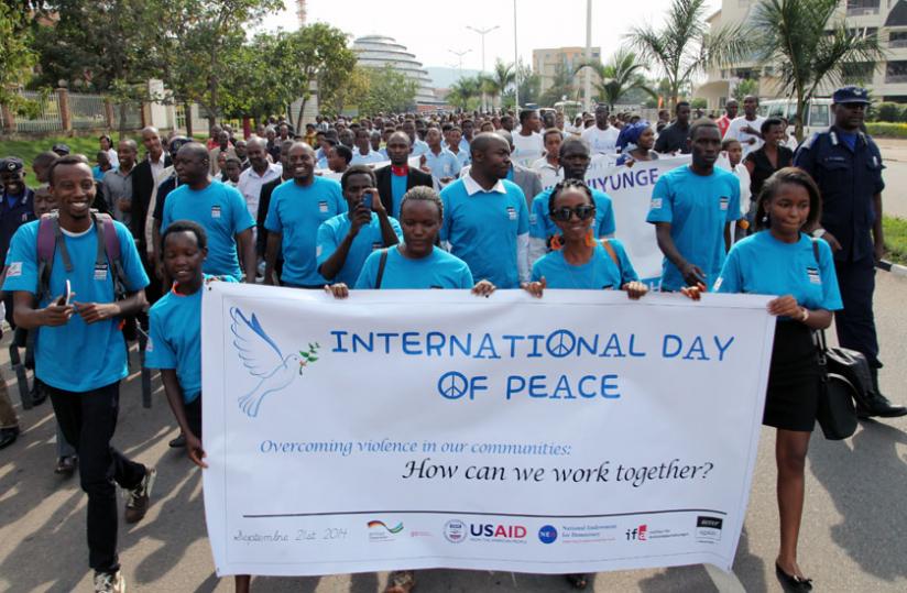 Youth and officials march to celebrate International Day of Peace in Kigali on Sunday. (John Mbanda)