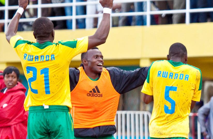Peter Kagabo (in orange) celebrates after Meddie Kagere, right, had scored against Mali during a 2014 Fifa World Cup qualifier in Kigali. (File photo)