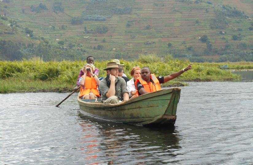 Birders take a boat on Lake Rugezi. The boat ride took about two hours. (Courtesy)