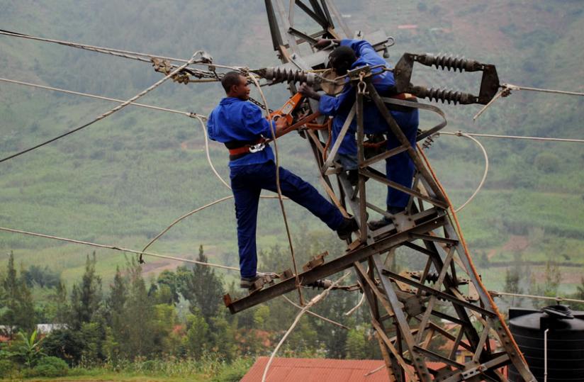 Workers fix a power line. (File)