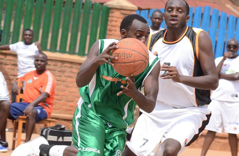 Espoir captain Aristide Mugabe (L) seen here in action during a local league game against APR, will be one of Rwanda's key players against Uganda. (File photo)