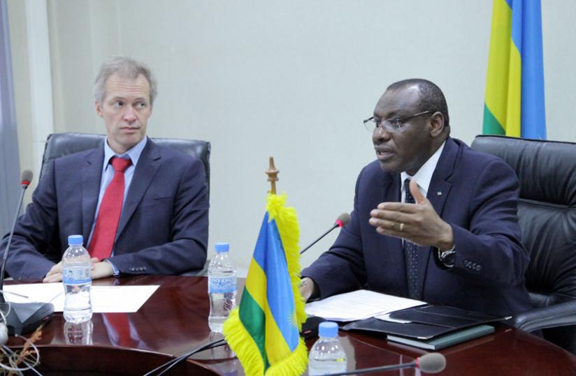 Finance and Economic Planning minister Claver Gatete (R) briefs the media at the signing ceremony in Kigali yesterday as Belgian ambassador to Rwanda Arnout Pauwels looks on. (John Mbanda)