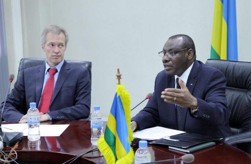 Finance and Economic Planning minister Claver Gatete (R) briefs the media at the signing ceremony in Kigali yesterday as Belgian ambassador to Rwanda Arnout Pauwels looks on. (John Mbanda)