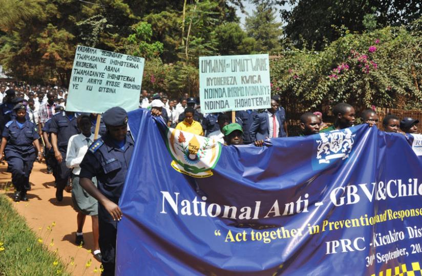 Anti-GBV and child abuse campaigners, including members of RNP, march in Kicukiro yesterday. (Courtesy)