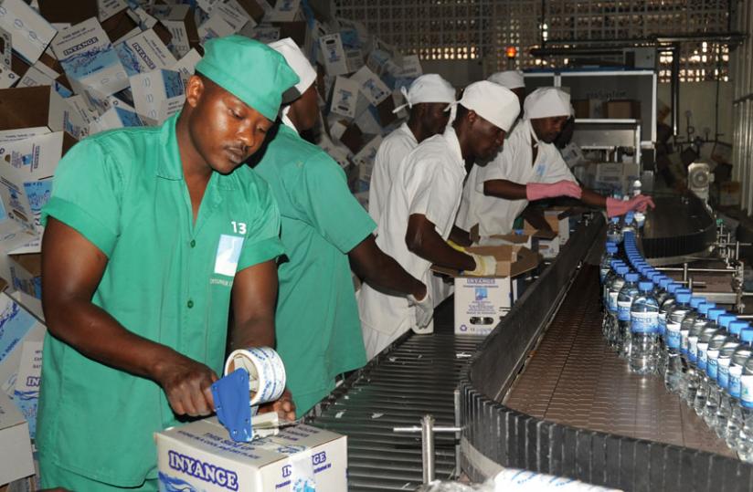 Inyange workers package bottled water.Industrialists like Inyange are scheduled to meet central bank officials to discuss various issues, including the high lending rates. (File)