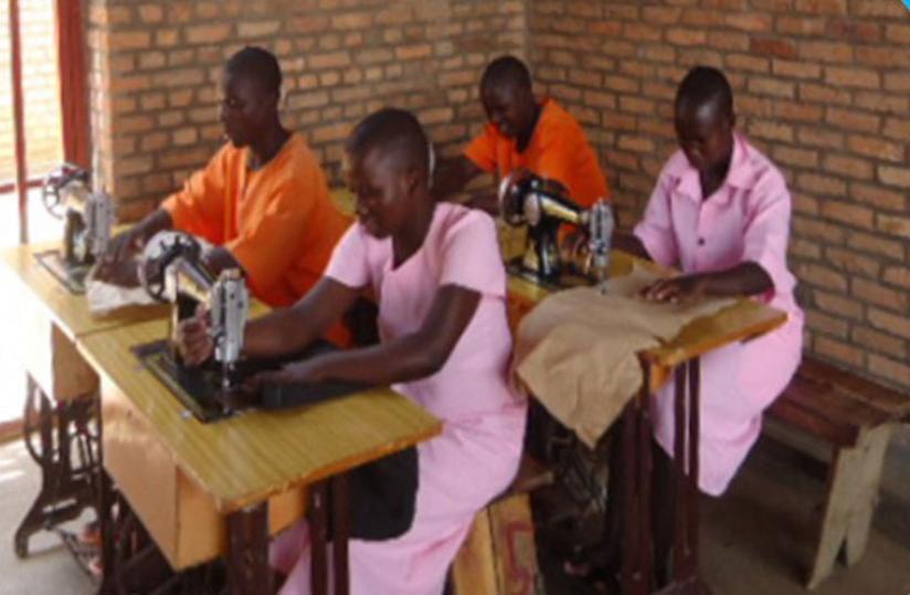 Female inmates learning how to sew. (Courtesy)