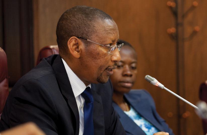 Rwangombwa addresses reporters Tuesday as Monique Nsazabaganwa, BNR vice-governor (right), looks on. (Timothy Kisambira)   