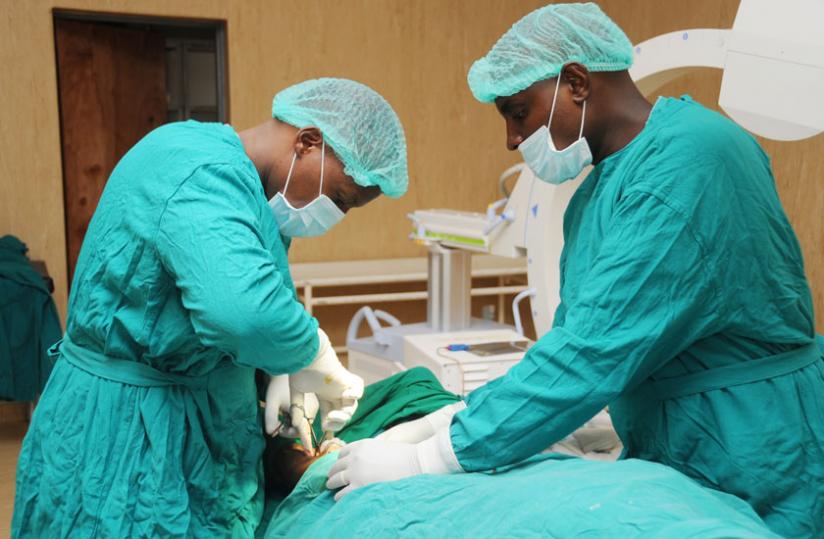 Doctors at Kanombe Military Hospital carry out an operation on April 26, 2012. (File)