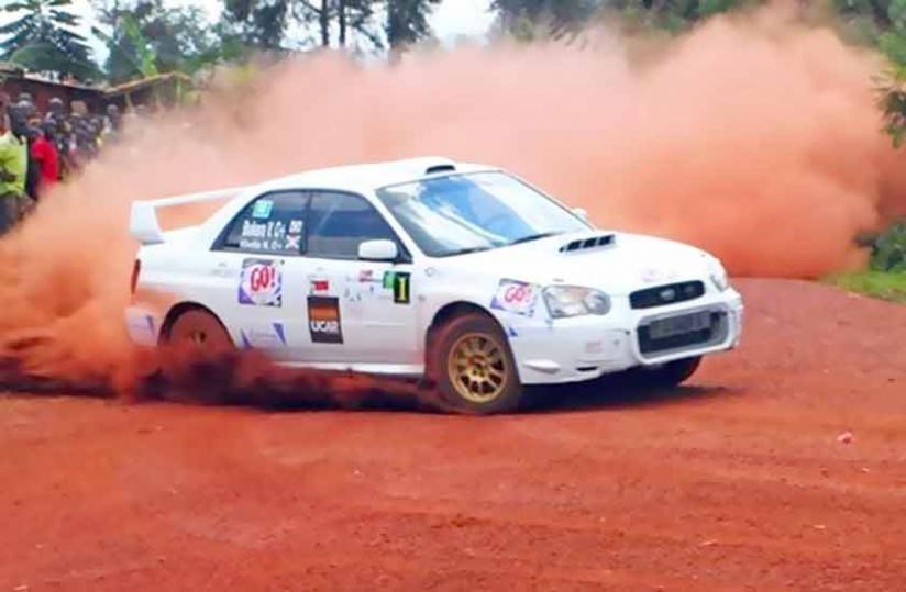 Burundian Bukera Valu00c3u00a9ry (inside the car), after winning the 2010 Huye Rally.  (File)