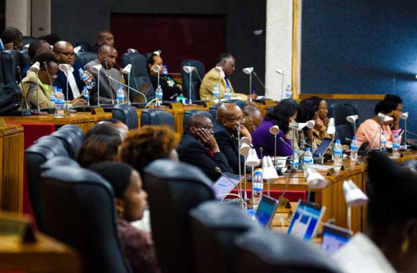 Members of Parliament attend a session earlier this month. (Timothy Kisambira)