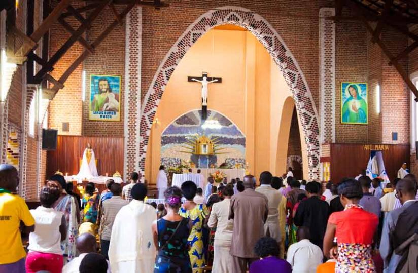 A congregation follows prayers at St Famille recently.(E.Ntirenganya)