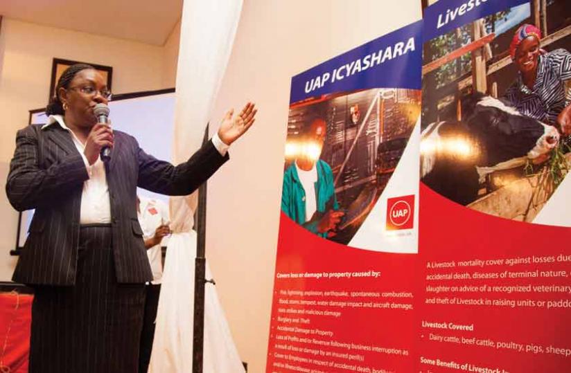 Wanjohi explains how the UAP Icyashara insurance policy works at the launch last week. (Timothy Kisambira)