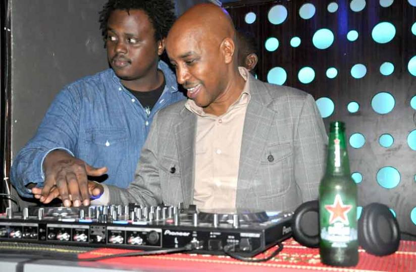 Nkurunziza (right) tries out the wheels of steel. 