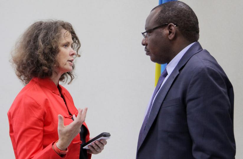 Turk (left) chats with Finance minister Claver Gatete last week. (John Mbanda)
