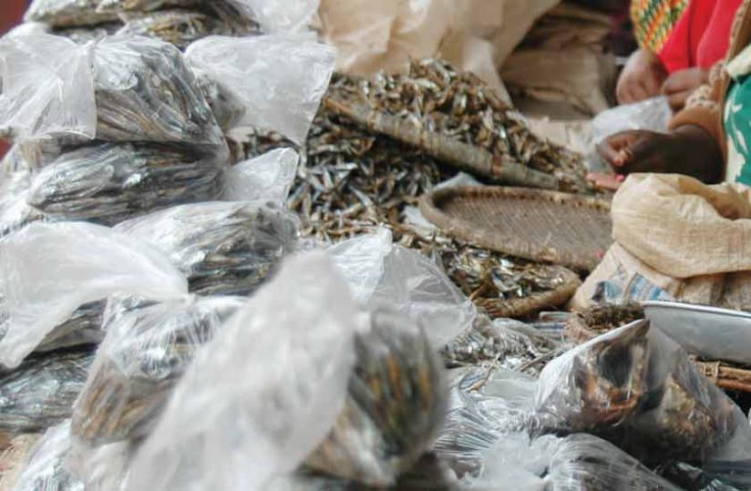 Fish vendors still use the banned plastic bags as packaging material. (File)