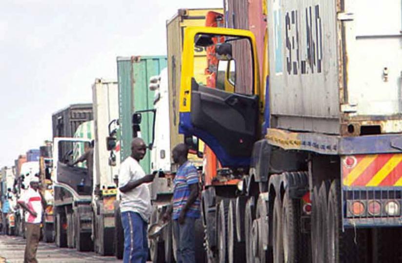 Truckers wait for clearance at the Kenya-Uganda border at Malaba. Delays are still persistant at some border points. 