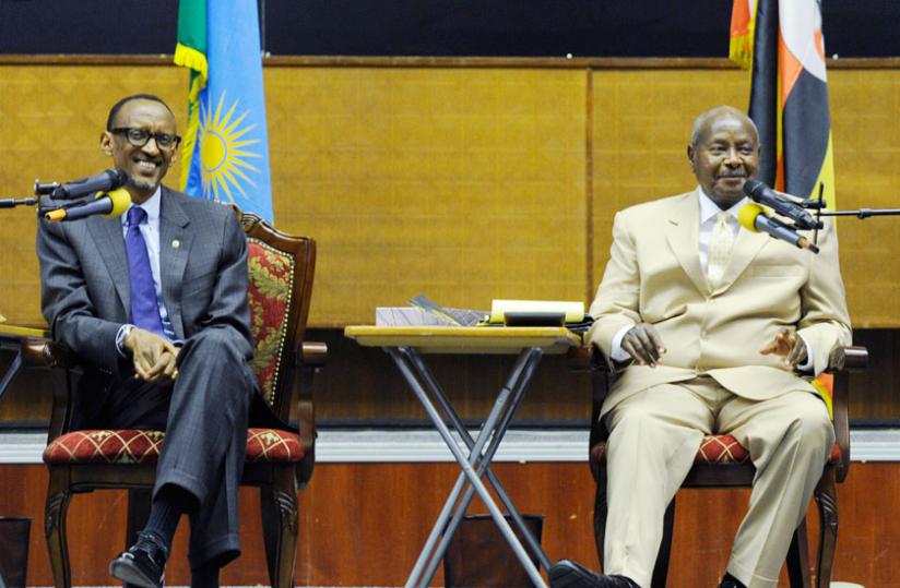 Presidents Kagame (L) and his Ugandan counterpart Yoweri Museveni at the third edition of the Uganda-Rwanda Business Forum in Kampala, yesterday. (Village Urugwiro)