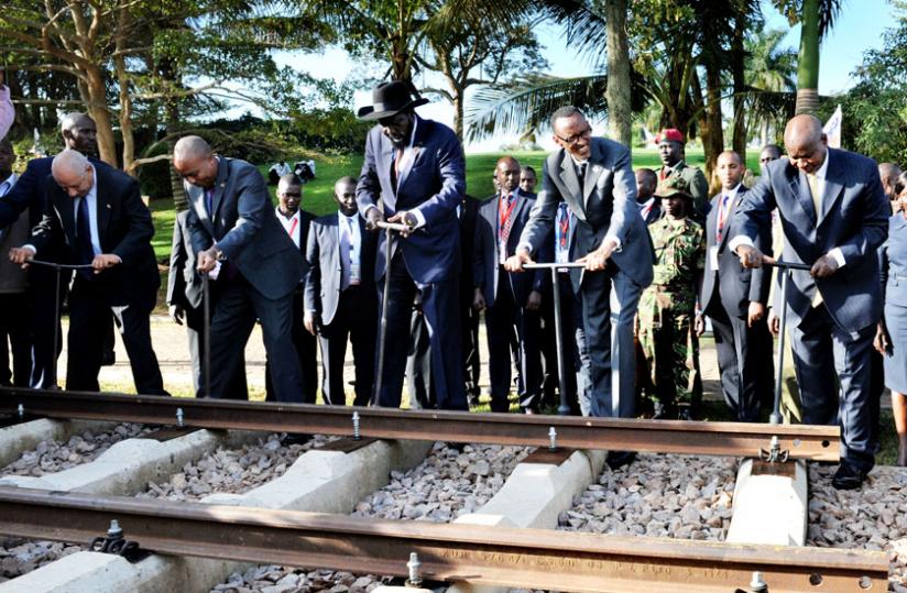 L-R; Dr Fassil Hahom, minister and legal advisor of Ethiopia, Eng. Michael Kamau, Kenyau00e2u20acu2122s Cabinet Secretary for transport and infrastructure, and Presidents Salva Kiir of South Sudan, Kagame (Rwanda) and Yoweri Museveni of Uganda, launch the regional standard guage railway in Kampala yesterday. (Village Urugwiro)