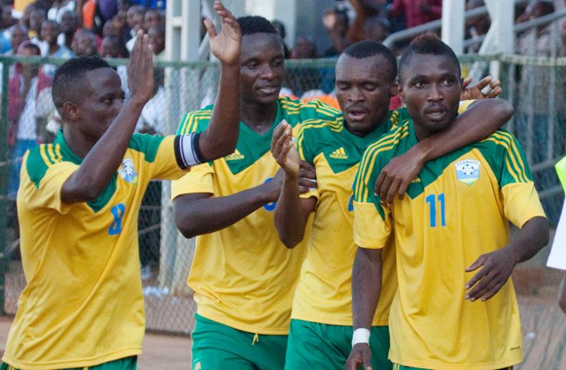 Dady Birori (or Tady Agiti Etakiama), right is joined by Amavubi teammates to celebrate his goal against Libya during the Afcon 2015 qualifiers. His inclusion in the national team would later see Rwanda disqualified from the qualifiers on the grounds that Birori uses dual identities. (File)