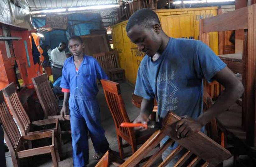Youth in a furniture workshop in Kigaliu00e2u20acu2122s Gakinjiro. (John Mbanda)