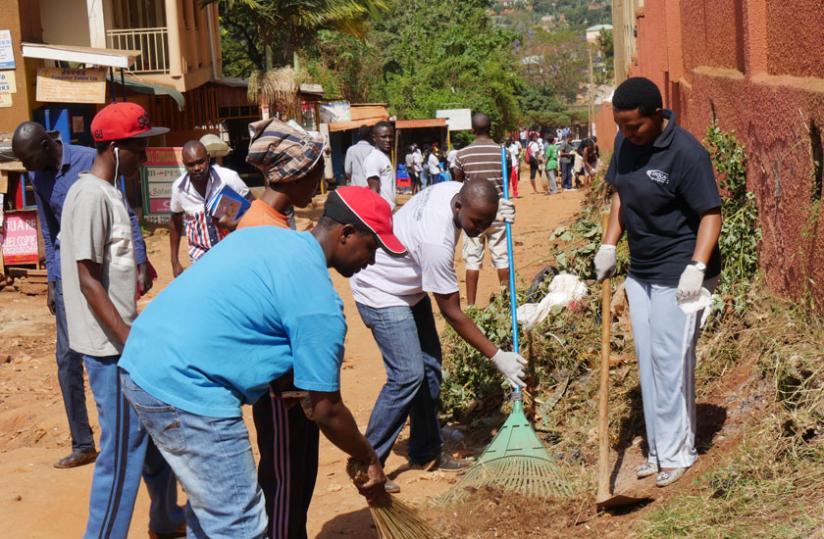 Rwandan Students during Umuganda in the Kampala suburb of Kansanga.  (Gashegu Muramira)