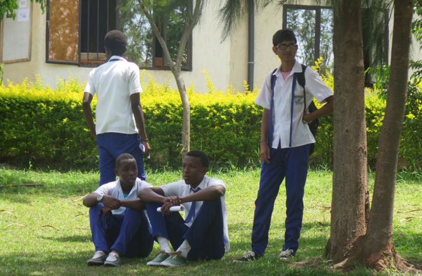 Students relax in the school compound. With a few days to the final exams, every minute counts.  (Solomon Asaba)