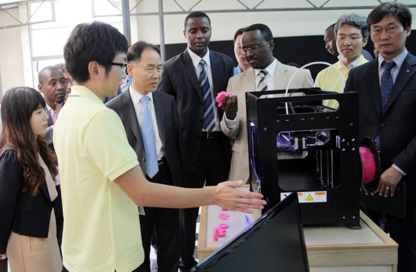 Amb. Hwang (R) Nkulikiyimfura (C), Principal IPRC Kicukiro Diogu00c3u00a8ne Mulindahabi and other officials tour the expo. (John Mbanda)