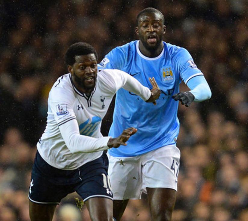 Adebayor of Tottenham is chased down by Yaya Toure of Man City during the Premier League last season. (Net photo)